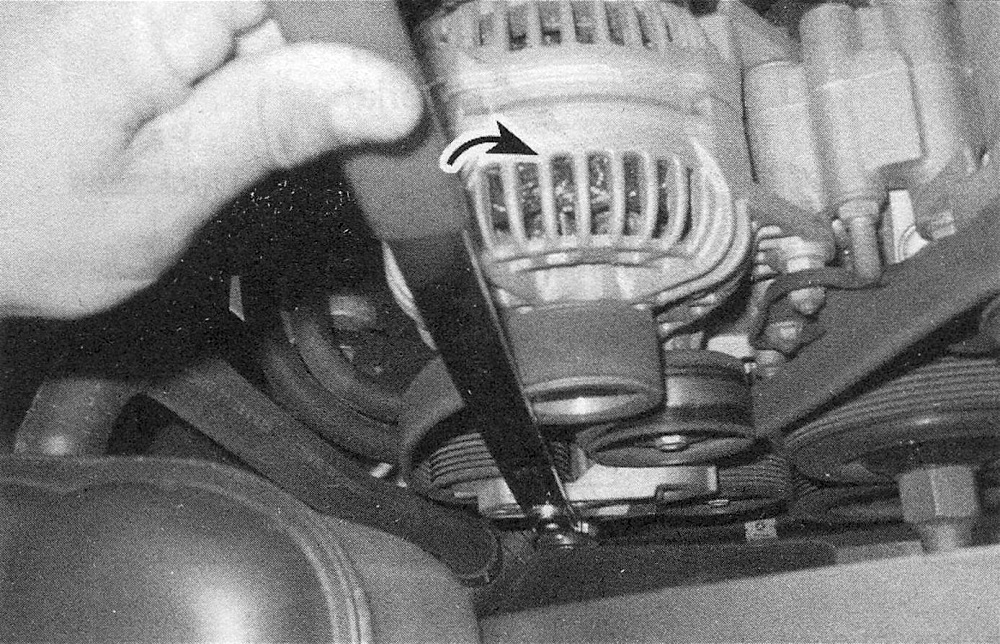 RAM Trucks Rotate the tensioner arm to relieve belt tension