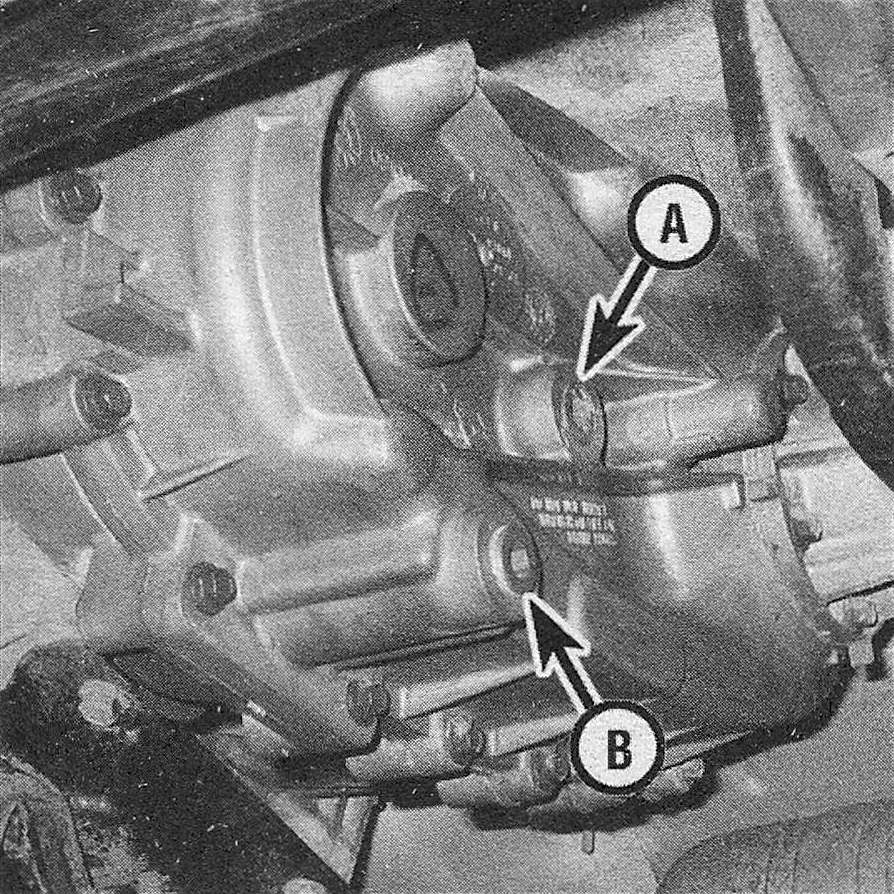 RAM Trucks The transfer case fill (A) and drain (B) plugs are located on the rear of the transfer case