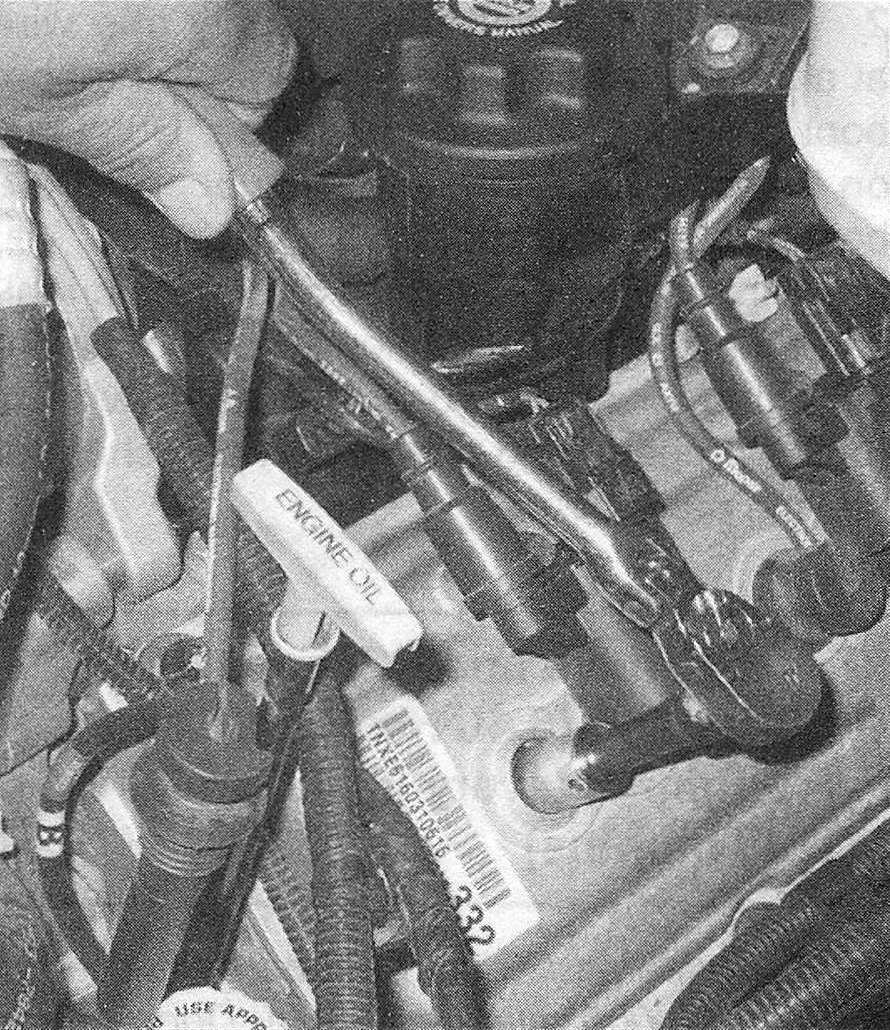 RAM Trucks Use a socket and extension to unscrew the spark plugs