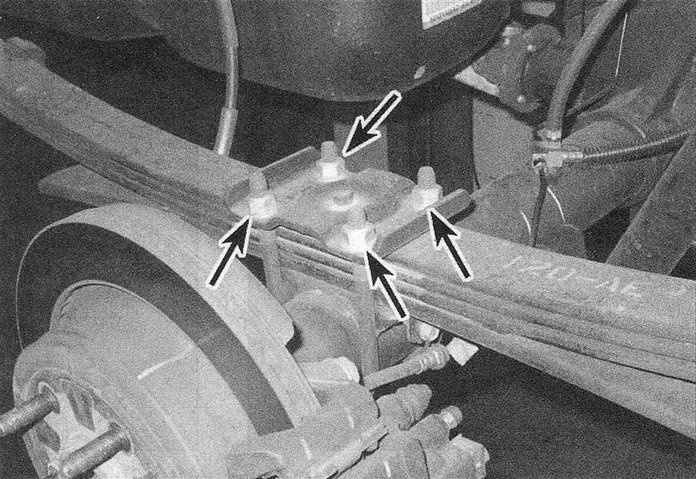 RAM Trucks To remove the spring plate and U-bolts, remove these four nuts