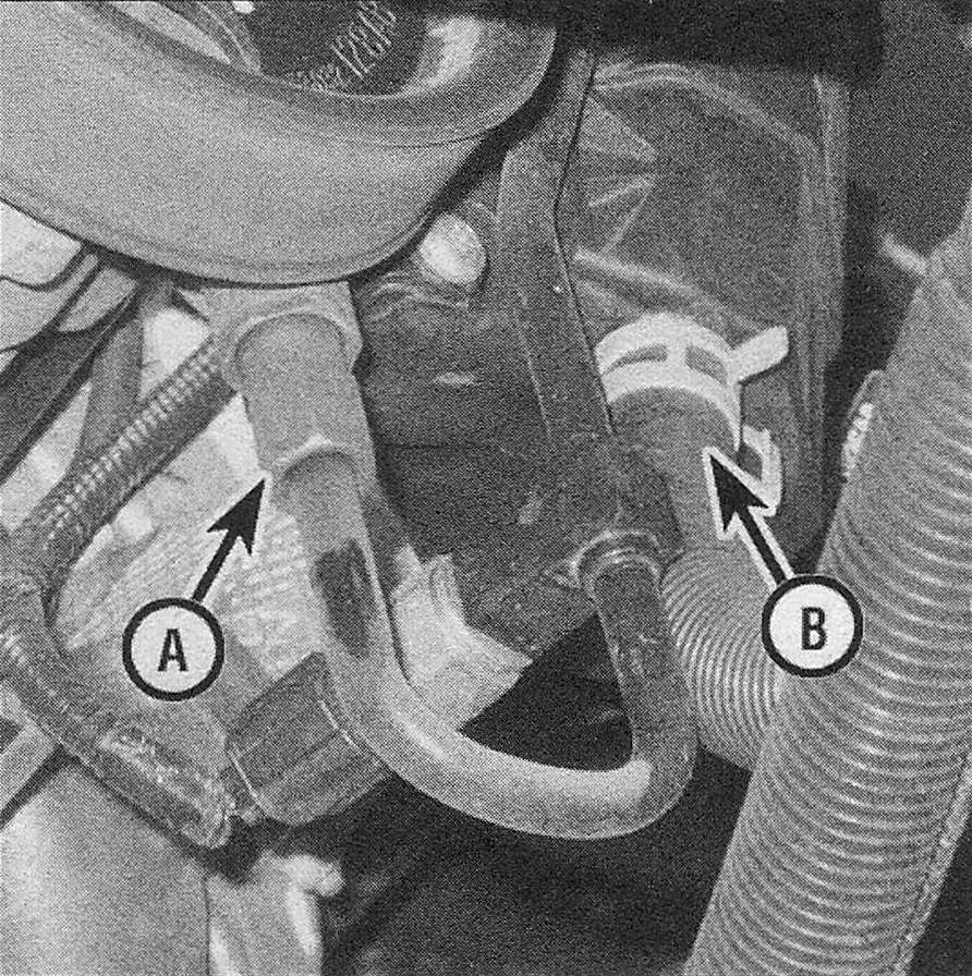 RAM Trucks Detach the pressure (A) and return (B) lines from the power steering pump (Hemi model shown)