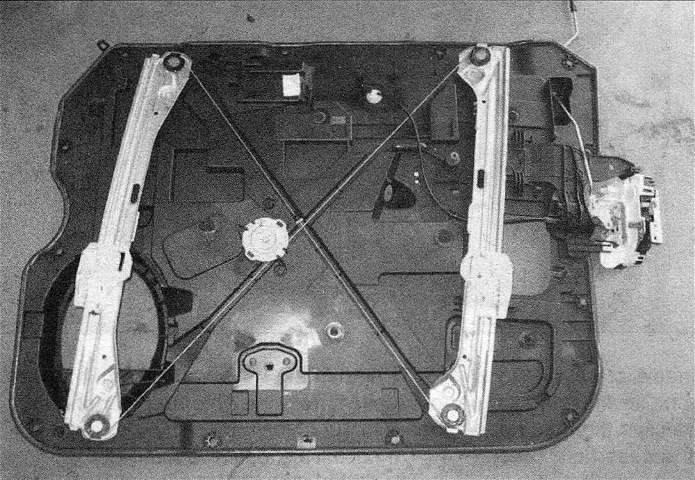 Ram Trucks Door carrier plate, latch, handles and lock cylinder - then set it on a workbench to service its components