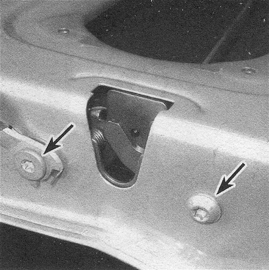 Ram Trucks Tailgate latch and handle - Remove the tailgate latch retaining screws; they're tight, so you may have to use the type of impact driver that is struck with a hammer