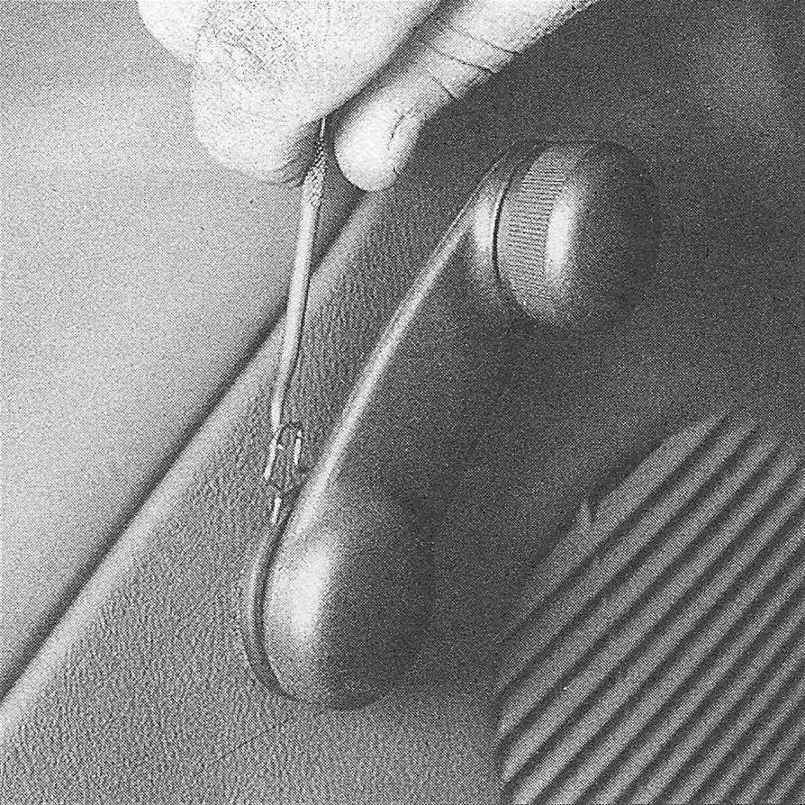 Ram Trucks Door trim panels - Remove the retaining clip, then detach the window crank handle. A hooked tool like this can be used, but special window crank clip removal tools are available at auto parts stores, and make this step much easier