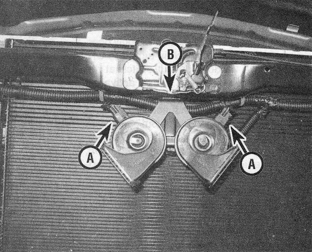 RAM Trucks Disconnect the horn wiring connectors (A), then unbolt the mounting bracket (B) and remove the horns along with the bracket (grille removed here for clarity)