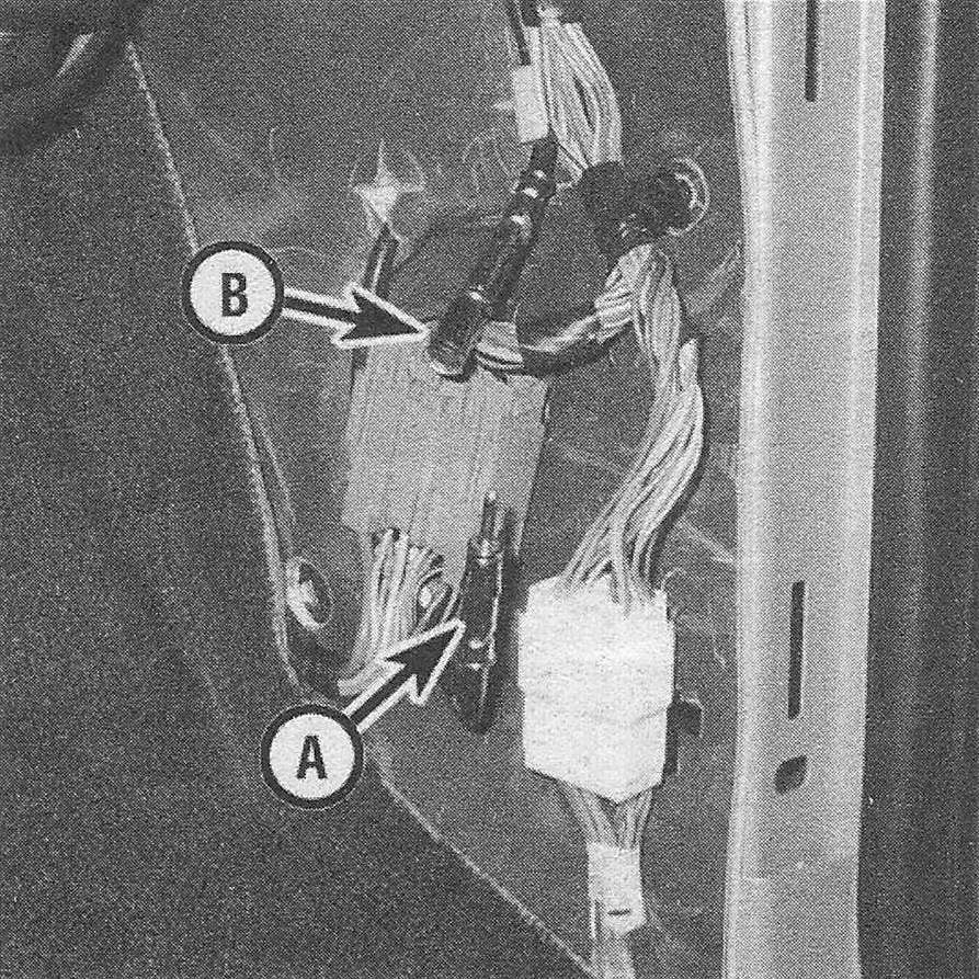 Ram Trucks Antenna and cable - Working in the right kick panel area, disconnect the antenna side of the cable (A) from the radio side of the cable (B)