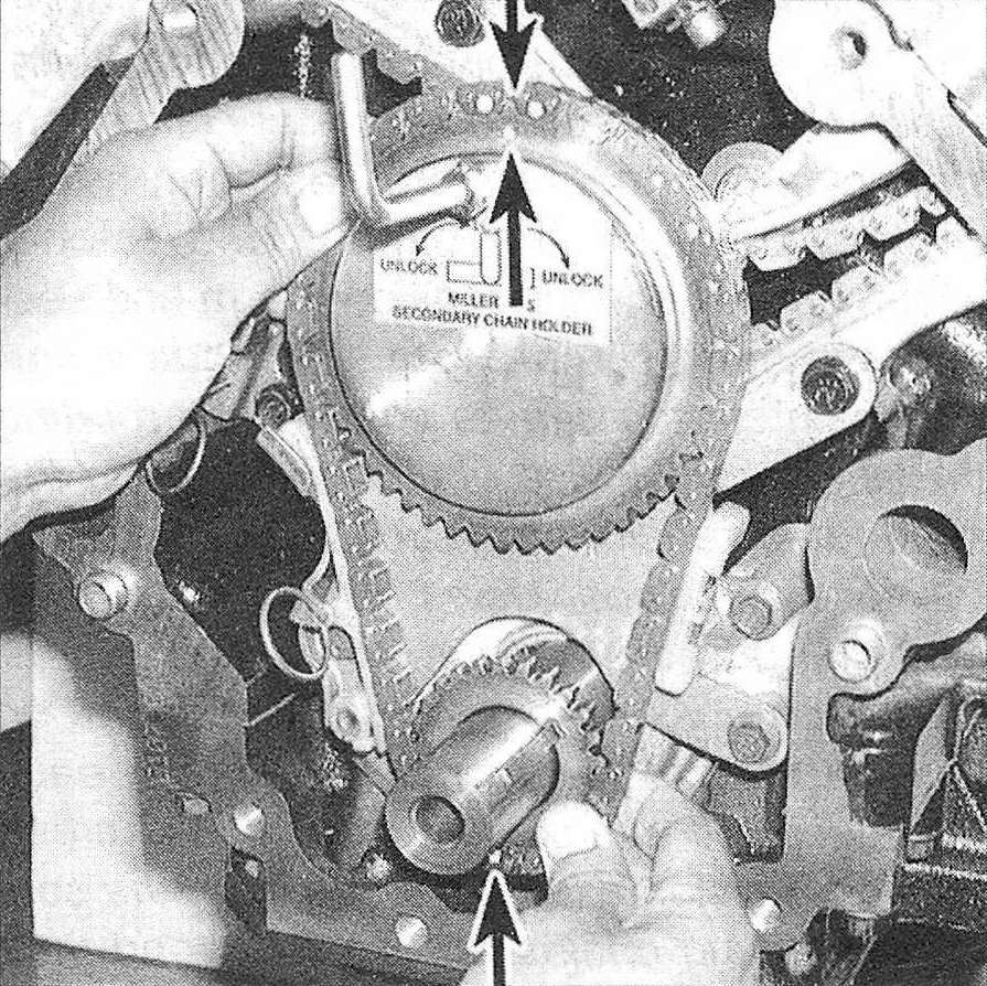 RAM Trucks 3.7L V6 and 4.7L V8 engines Align the timing mark on the idler procket gear with the timing mark on the counterbalance shaft, then install the idler sprocket, the crankshaft sprocket, the timing chains and the chain holding tool as an assembly onto the engine with the marks aligned as shown - feed the secondary chains up through the timing chain guides and loop them over the camshaft hubs, then push the primary chain assembly the rest of the way until it's seated