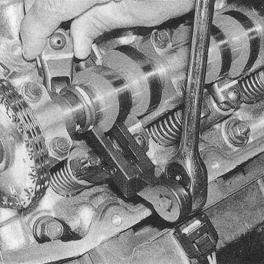 RAM Trucks 3.7L V6 and 4.7L V8 engines Using a special type valve spring compressor, depress the valve spring just enough to remove the rocker arm