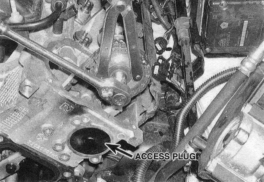 RAM Trucks 3.7L V6 and 4.7L V8 engines Remove the left camshaft sprocket bolt while holding the sprocket with a pin spanner wrench - note the chain guide access plug