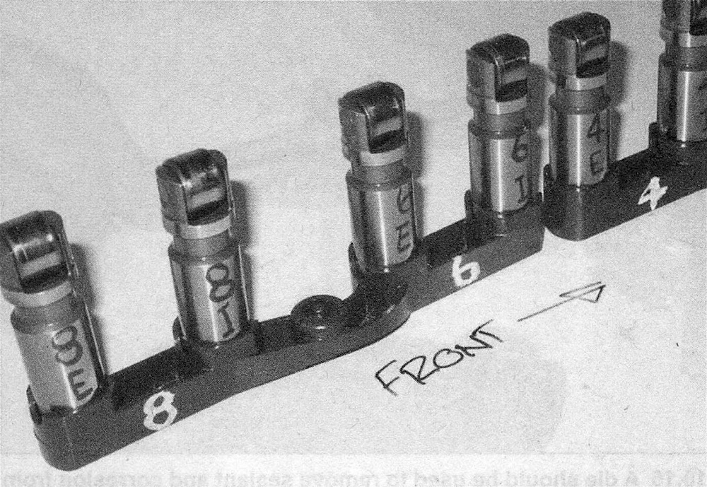 RAM Trucks Hemi engine Install the lifters into the lifter rail and make sure the lifters are marked in their original position (UP) with number designations for the cylinders and letter designations for the valve each one operates (intake or exhaust)