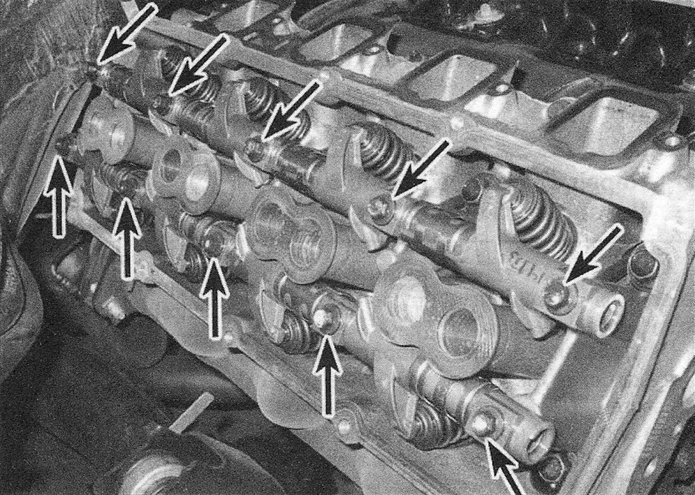 RAM Trucks Hemi engine Remove the rocker arm shaft bolts - mark each rocker arm assembly and note that the upper rocker arms are the intake and the lower rocker arms are the exhaust