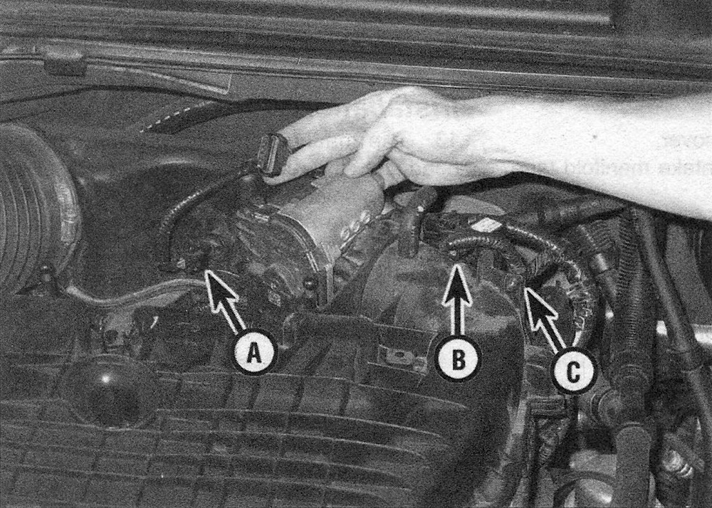 RAM Trucks 3.6L V6 engine Disconnect the ETC connectors (A), the MAP sensor (B) and the electrical harness (C) retainer