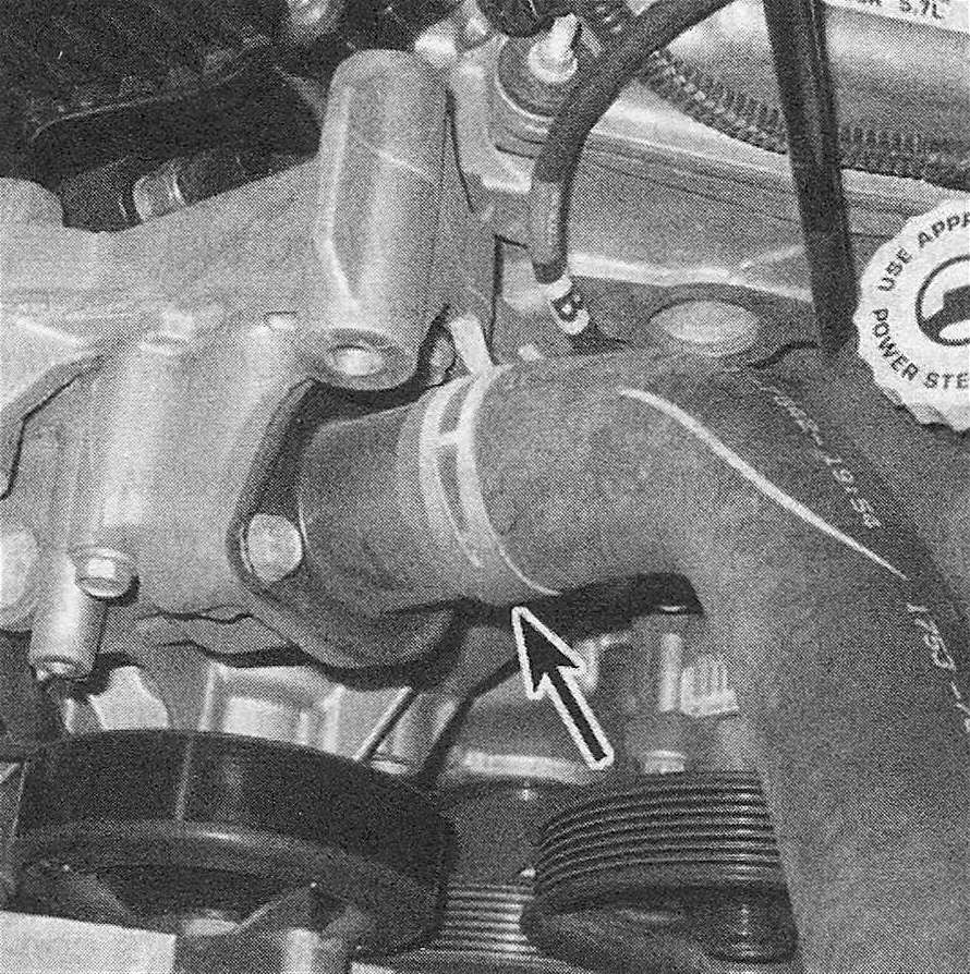 RAM Trucks Thermostat housing location (Hemi engine) - the air conditioning compressor is removed for clarity