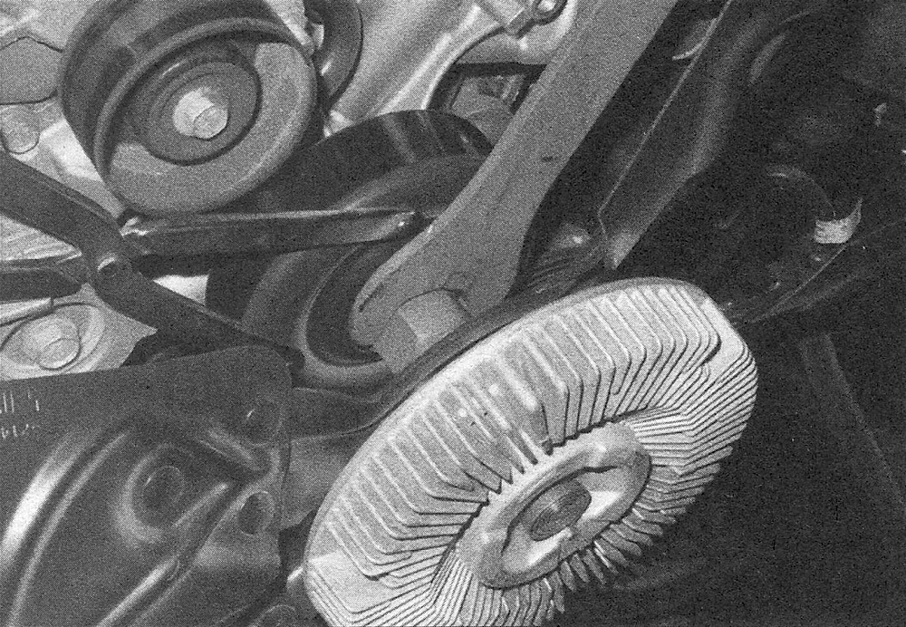 RAM Trucks Use a pin spanner wrench or a strap wrench to prevent the water pump pulley from turning, then loosen the fan clutch nut