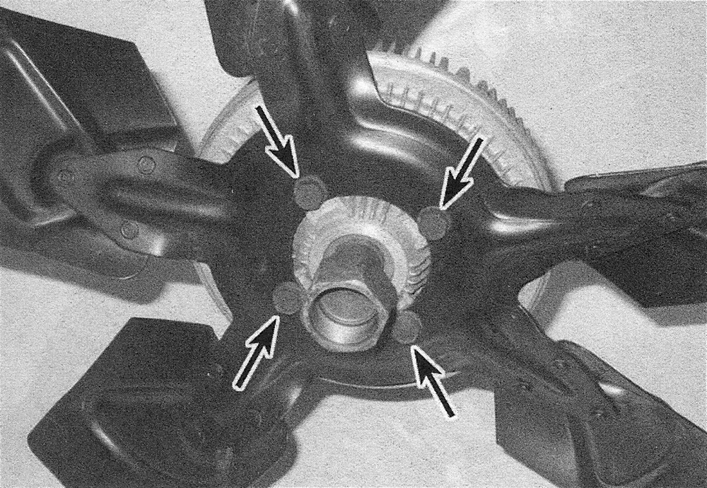 RAM Trucks Remove the four bolts retaining the cooling fan to the fan clutch (Hemi engine shown, other models similar)