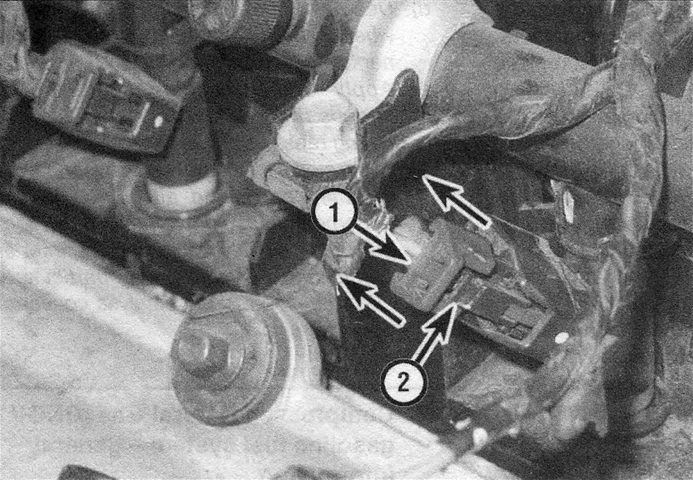 RAM Trucks Fuel and exhaust systems - gasoline engines To disconnect an electrical connector from an injector on a Hemi engine, move the red slider (1) away from the injector, then depress the release tab (2) and pull off the connector