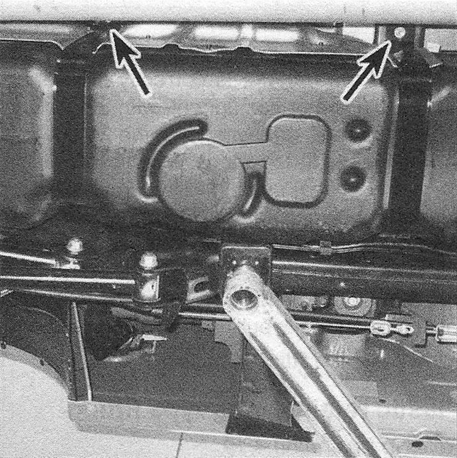 RAM Trucks Fuel and exhaust systems - gasoline engines To detach the fuel tank from the bottom of the vehicle, remove these two fuel tank strap nuts, then allow the fuel tank straps to swing down (they're hinged) and disengage the left end of each strap from its hinge by lifting up the end of the strap