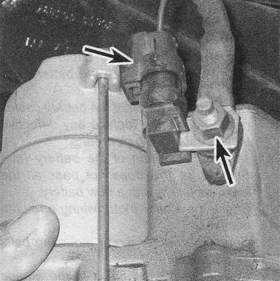 RAM Trucks Engine electrical systems After unbolting the starter motor and moving it forward, remove the nut that secures the battery positive cable to the stud terminal on the solenoid, disconnect the positive cable from the stud, then disconnect the electrical connector from the spade terminal on the solenoid