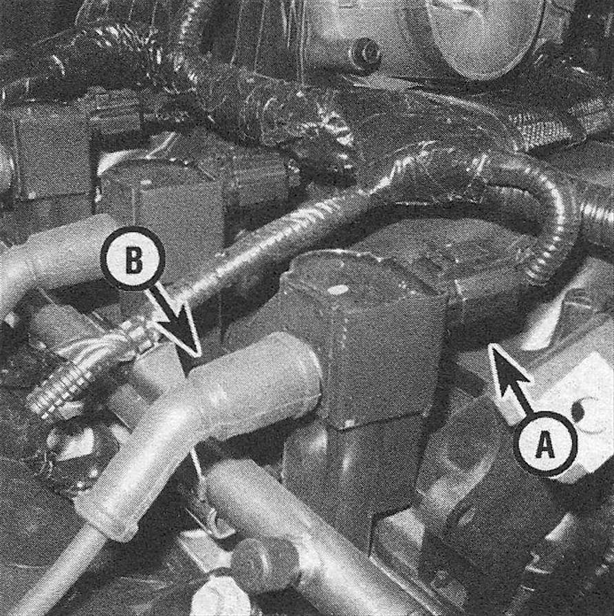 RAM Trucks Engine electrical systems 4.7L V8 ignition coil primary wiring connector (A) and the secondary wire that connects to a lower spark plug (B) - the coil itself is mounted directly on top of the upper spark plug