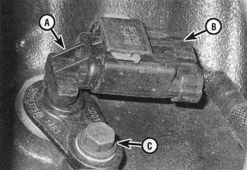 RAM Trucks Disconnect the CKP sensor (A) electrical connector (B) and remove the sensor mounting bolt (C) (Hemi engine, right-rear side shown)