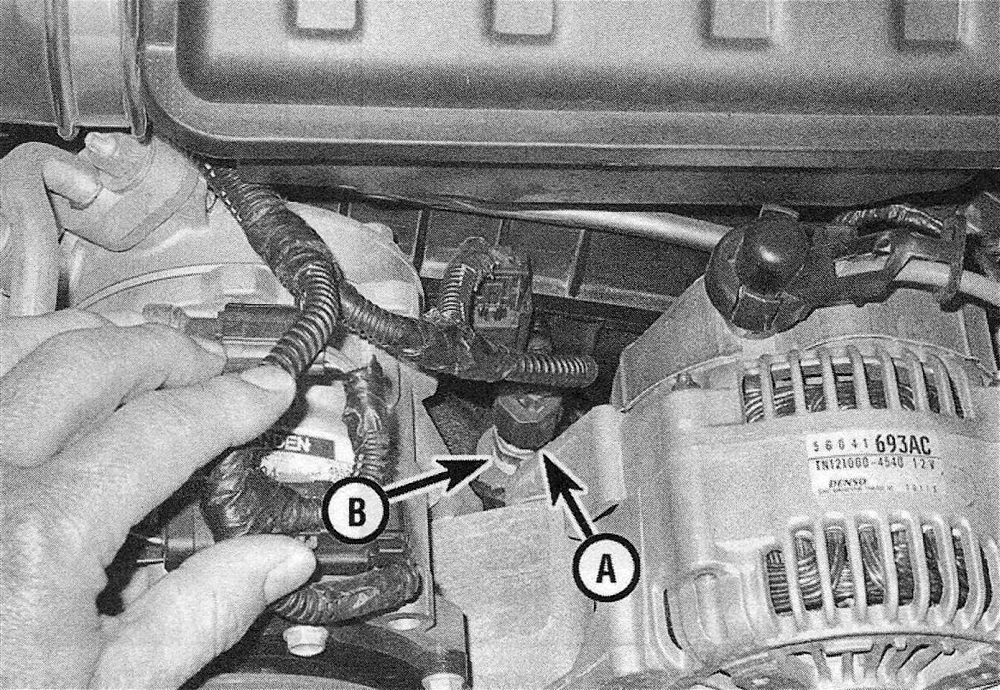 RAM Trucks Disconnect the ECT sensor electrical connector (A) and unscrew the sensor (B) from the manifold (3.7L V6 engine)