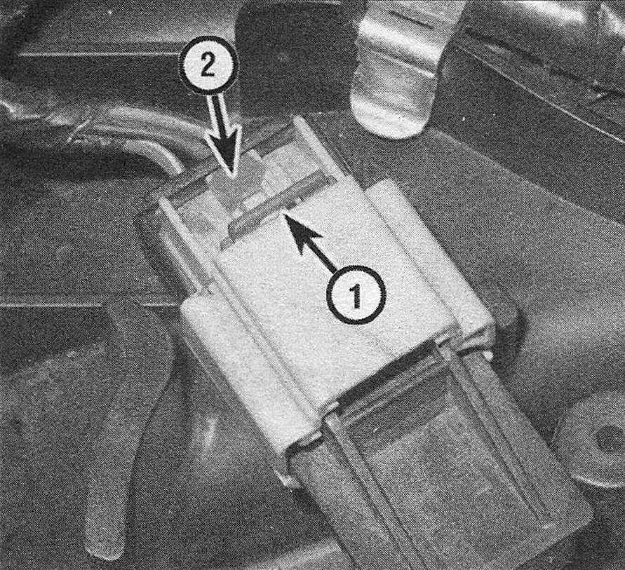 RAM Trucks Slide the release lock (1) away from the MAP sensor (toward the harness), then depress the release tab (2) and pull off the connector (Hemi engine)