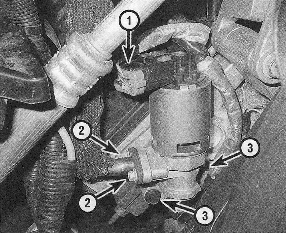 RAM Trucks Disconnect the EGR valve electrical connector (1), remove the EGR pipe flange (2), then remove the EGR valve bolts (3) (typical V6 or V8 engine)