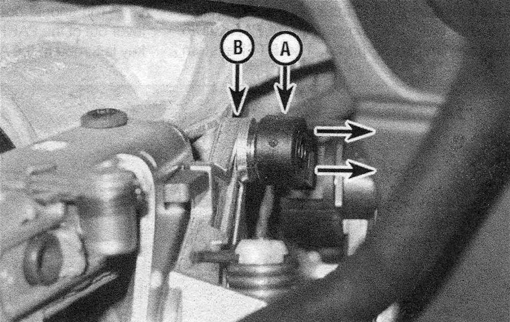 RAM Trucks Automatic transmission Insert a small screwdriver between the shift cable (A) and the shift lever pin (B) to disconnect them