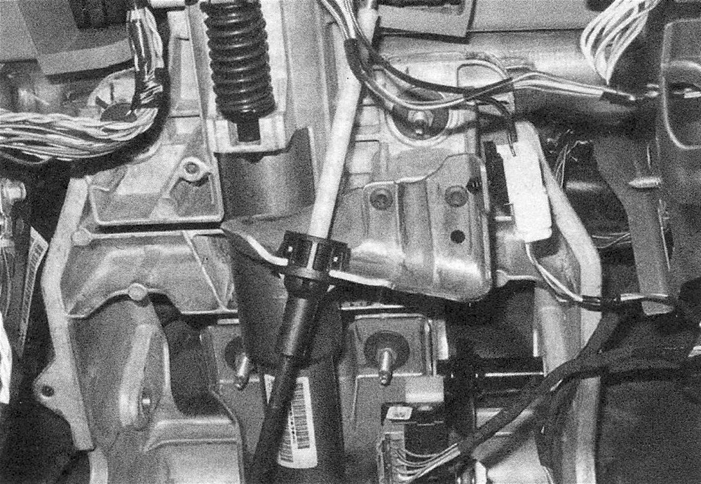 RAM Trucks Automatic transmission To disengage the shift cable assembly from its mounting bracket, squeeze the tangs on the cable housing together, then pull the cable assembly straight down. To remove the cable assembly, disengage the grommet from the cable hole in the firewall, then pull the cable through the hole into the cab