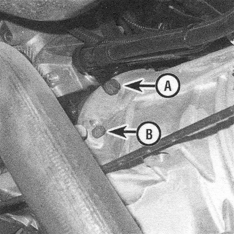 RAM Trucks  Automatic transmission To detach the transmission from the engine, remove all transmission- to-engine bolts (A) and engine-to- transmission bolts (B) (left side shown, right side similar; not all bolts visible in this photo)