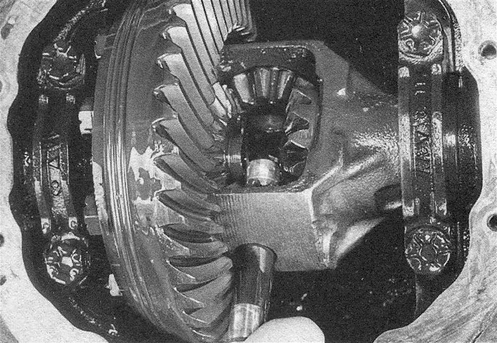 RAM Trucks Rear axleshaft - carefully remove the pinion mate shaft from the differential carrier (don't turn the wheels or the carrier after the shaft has been removed, or the pinion gears may fall out)