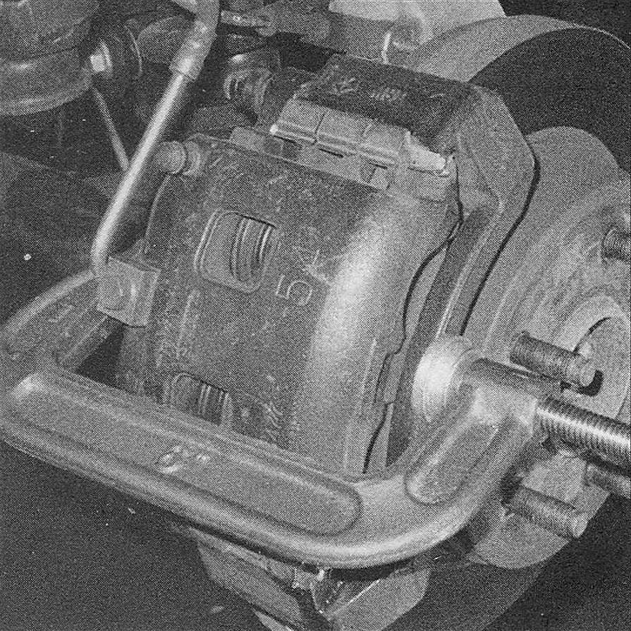 RAM Trucks Brakes Before removing the caliper, depress the piston into the bottom of its bore in the caliper with a large C-clamp to make room for the new pads