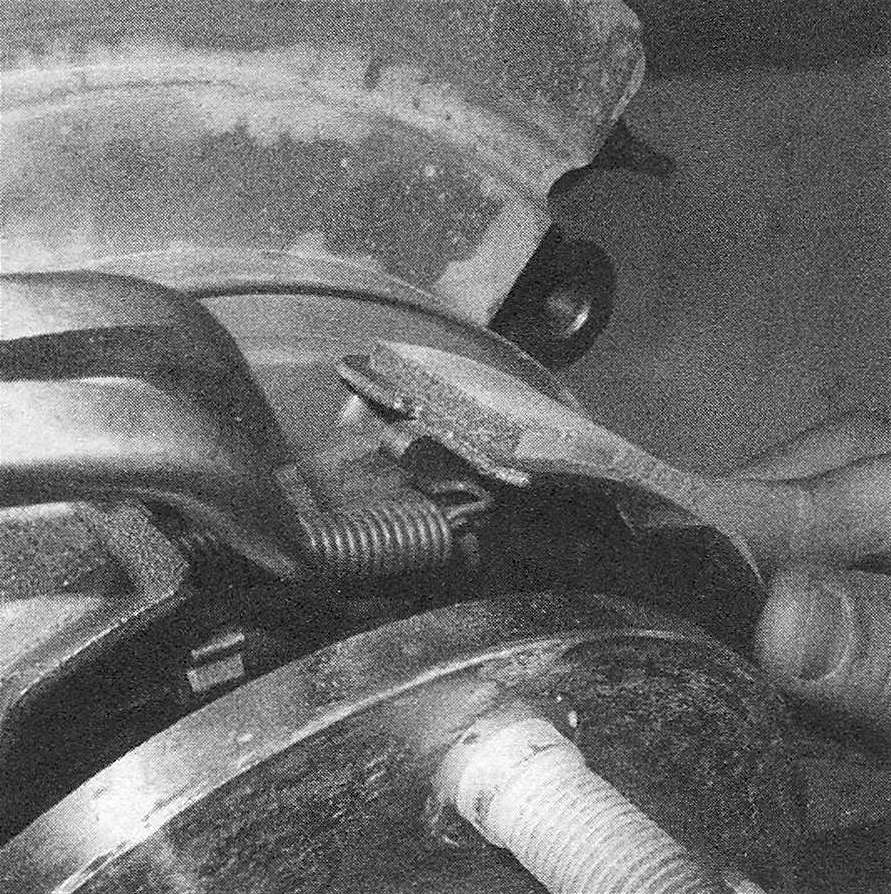 RAM Trucks Brakes Use needle nose pliers to detach the upper return spring from both shoes